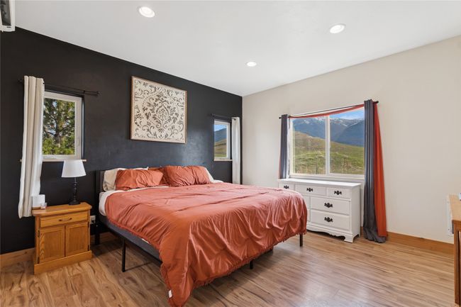 Bedroom featuring recessed lighting, light wood-style floors, and multiple windows | Image 33