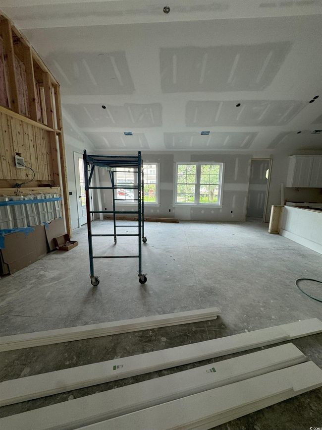 Misc room with vaulted ceiling and a garage | Image 30