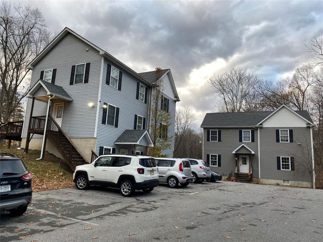 View of front of home with uncovered parking and entry steps | Image 19