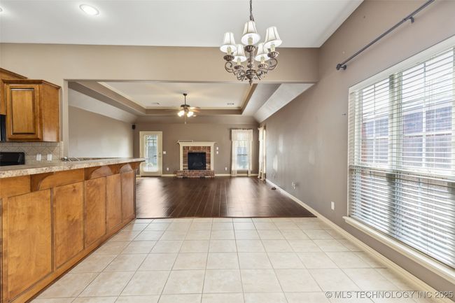 Breakfast table area looking into living room | Image 6