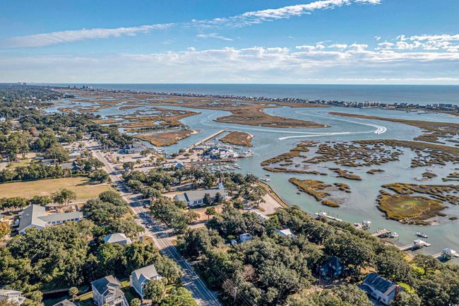 Aerial view of property's location with a large body of water | Image 33