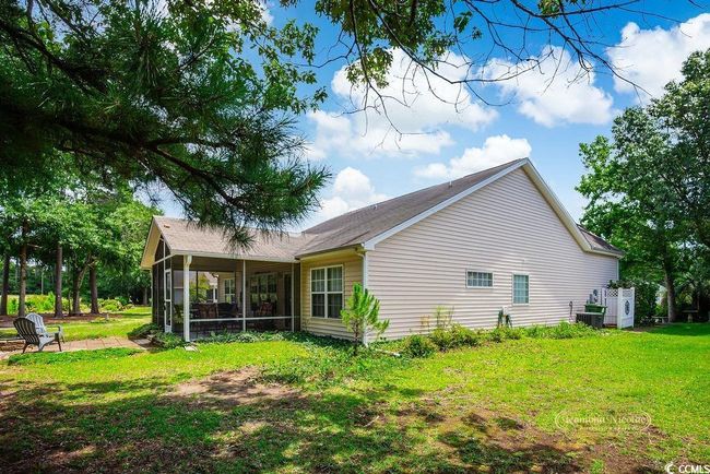 View of side of property with a sunroom and a lawn | Image 31