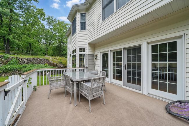 View of patio featuring outdoor dining area | Image 43