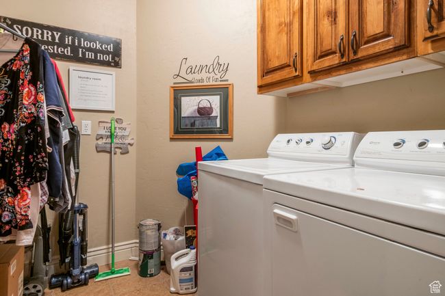Laundry area with washer and clothes dryer, cabinet space, and tile patterned floors | Image 13