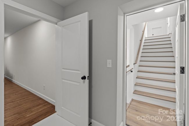 Staircase leading to finished space above the garage | Image 28