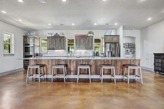 An island large enough for everything! At nearly 17' long, you have space to entertain as well as serve casual meals. Kids can do homework while parents prepare dinner. | Image 12