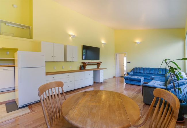 Dining space featuring light wood-style floors and lofted ceiling | Image 39