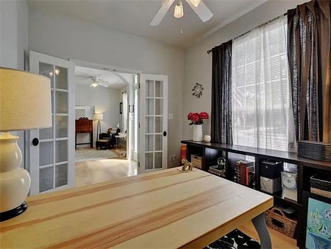 Dining space with ceiling fan, french doors, and wood finished floors | Image 5