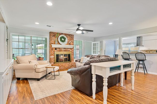 Brick fireplace adds such welcoming warmth to this family room | Image 13