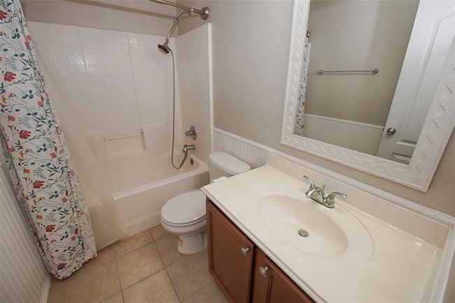 In between the additional bedrooms is an extra bathroom with combo bath and shower. | Image 24