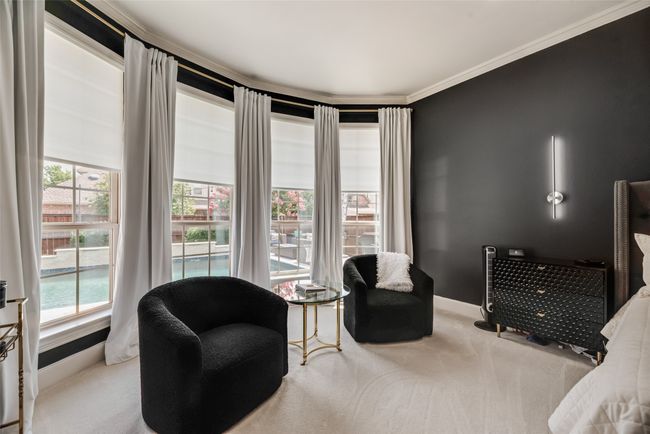 Seating area with carpet floors and crown molding | Image 9