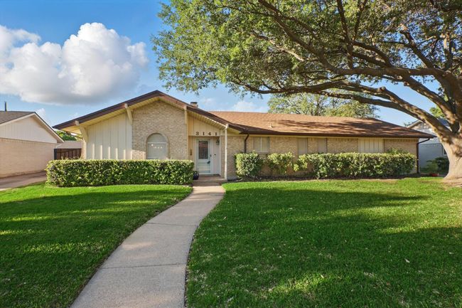 Single story home with brick siding and a front yard | Image 34