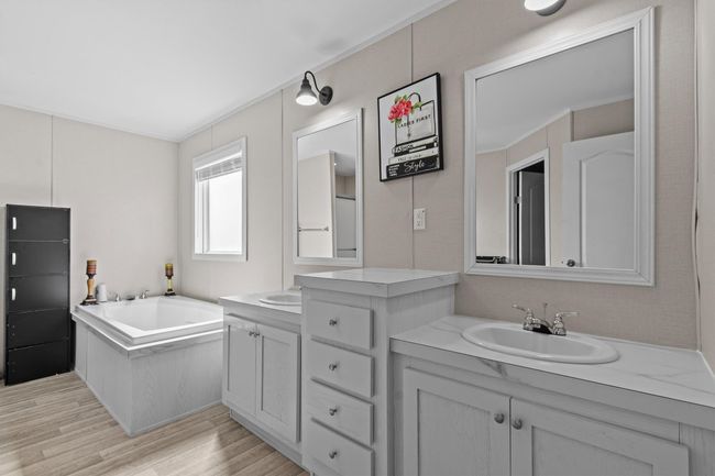 The centerpiece is a spacious 2, 061 sq ft manufactured home, just 1.5 years old, with 4 bedrooms, 2 bathrooms, and a beautifully crafted 40' x 20' stone outdoor kitchen under a covered roof with lighting—ideal for hosting under the stars. | Image 11