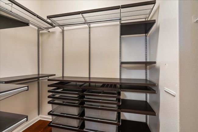 The primary closet also features custom shelving. | Image 12