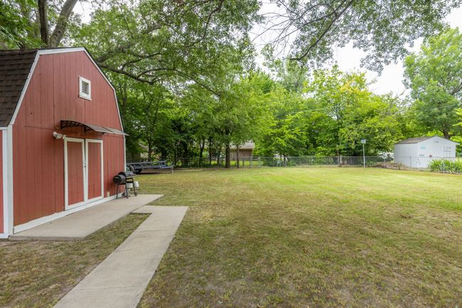 View of yard with an outbuilding and view of scattered trees | Image 36