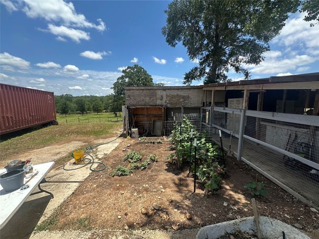 View of yard featuring an outbuilding and an exterior structure | Image 27