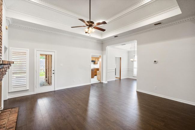 Secondary view of the spacious, primary living room. | Image 11
