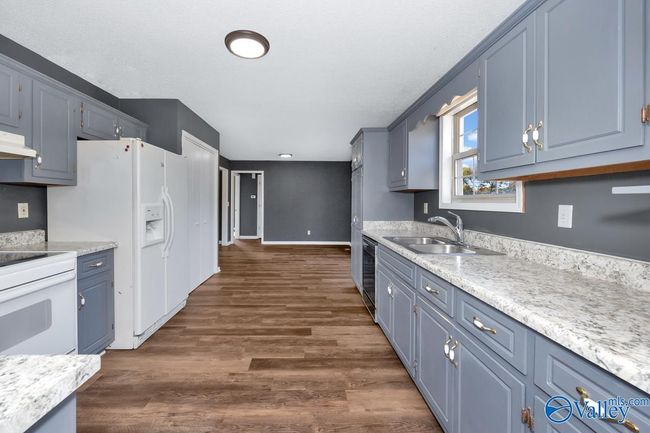 New LVP flooring and paint, wood cabinetry, pantry | Image 26