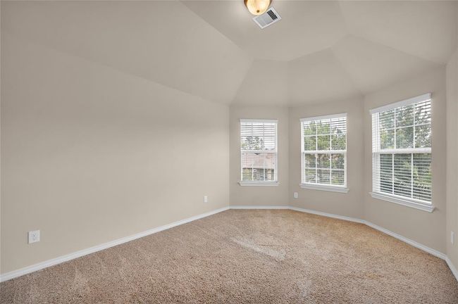 Cozy secondary bedroom featuring plush carpet and ample natural light. | Image 27
