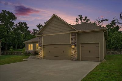 View of front of property featuring a garage and a lawn | Image 3