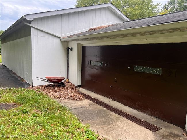 Entrance to property featuring a garage | Image 6
