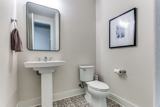 Bathroom with baseboards and tile patterned flooring | Image 19