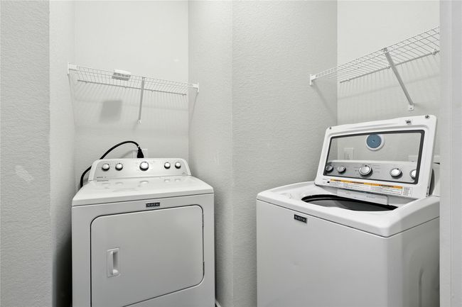 Laundry room is inside the home. | Image 22