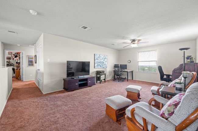 The 2nd level features a large den that can be used as an additional living space or converted into whatever your heart desires. | Image 15