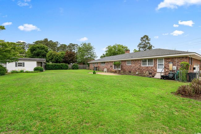 View of yard with a patio and central AC | Image 4