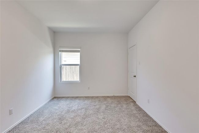 Carpeted empty room featuring baseboards | Image 21