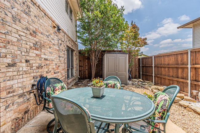 Fenced backyard with outdoor dining space and a patio area | Image 20