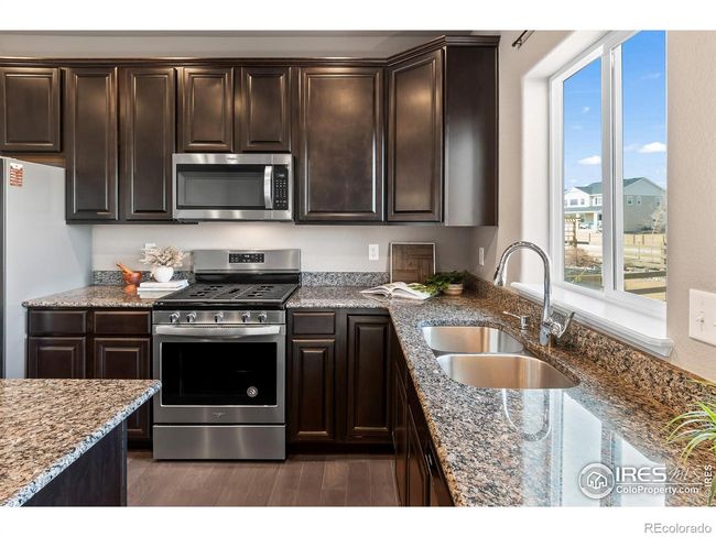 1410 Larimer Ridge Pkwy, House other with 3 bedrooms, 3 bathrooms and 3 parking in Timnath CO | Image 35