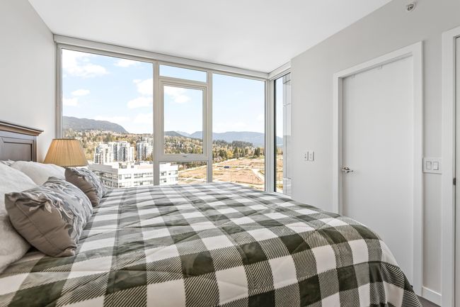 Bedroom featuring a mountain view | Image 15