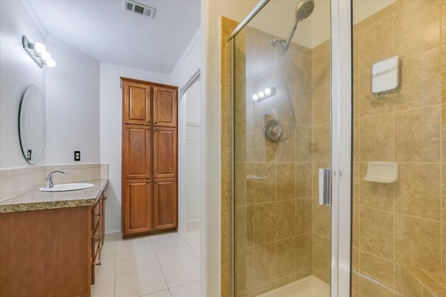Primary Bathroom has a walk-in shower and a large walk-in closet | Image 14