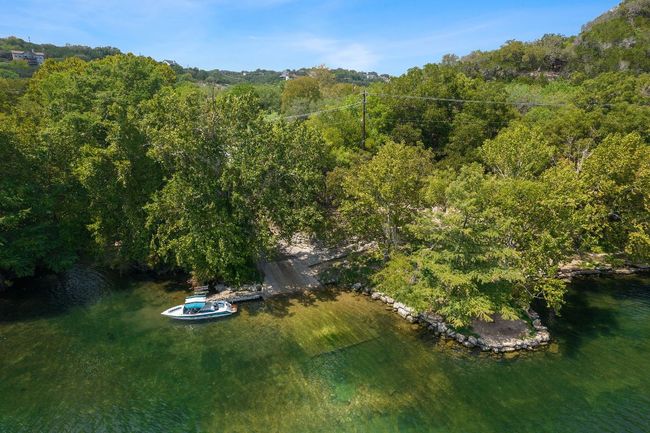 Birds eye view of property with a wooded view and a water view | Image 34