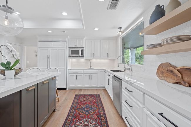 High end appliances including a Sub-zero refrigerator. | Image 13
