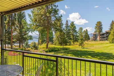 Patio featuring a beautiful lake view | Image 1