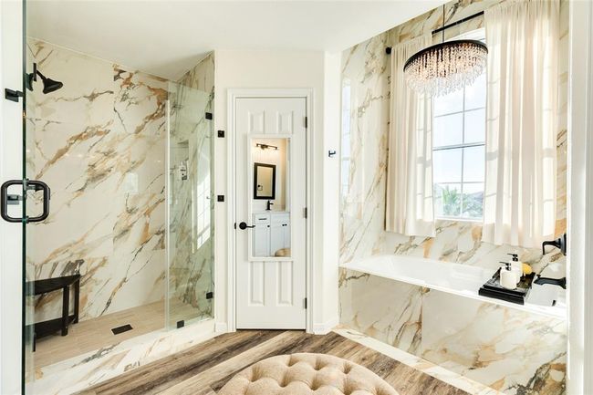 Upgrades to the walk-in shower include new floor and wall tile, and a frameless glass door | Image 35