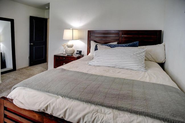 Bedroom featuring carpet floors | Image 30
