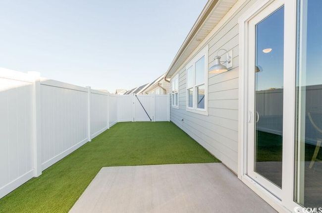 View of yard with a patio area and a fenced backyard | Image 16