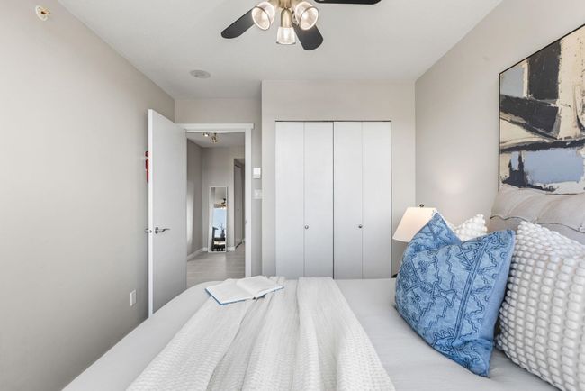 Bedroom featuring ceiling fan and a closet | Image 16