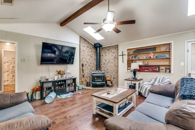 Wood Beam Accents the Beautiful Beadboard Ceiling | Image 7