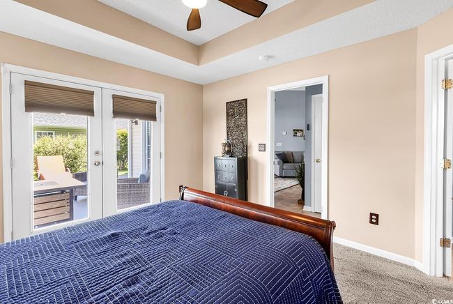 Bedroom featuring french doors, access to exterior, carpet, and ceiling fan | Image 26