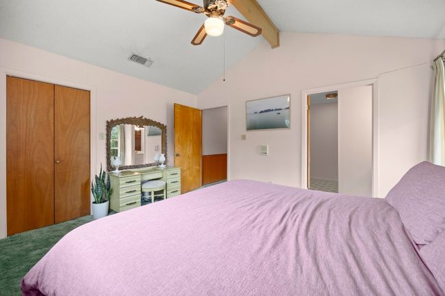 Carpeted bedroom with a ceiling fan | Image 17
