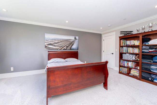 Carpeted bedroom with crown molding, baseboards, and recessed lighting | Image 16