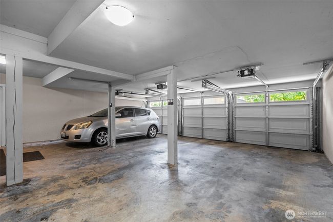 The center space is for Apt 203. This garage is shared with 2 other homes. There is also a storage room on this lowest level (ground level). | Image 31
