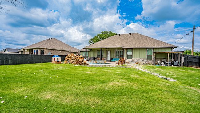 Rear view of house with a patio area | Image 30