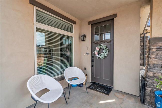 Entrance to property featuring stucco siding | Image 5