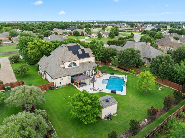 Aerial perspective of suburban area featuring a pool area | Image 11