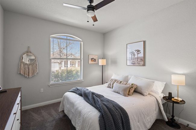 Carpeted bedroom featuring baseboards and a ceiling fan | Image 24